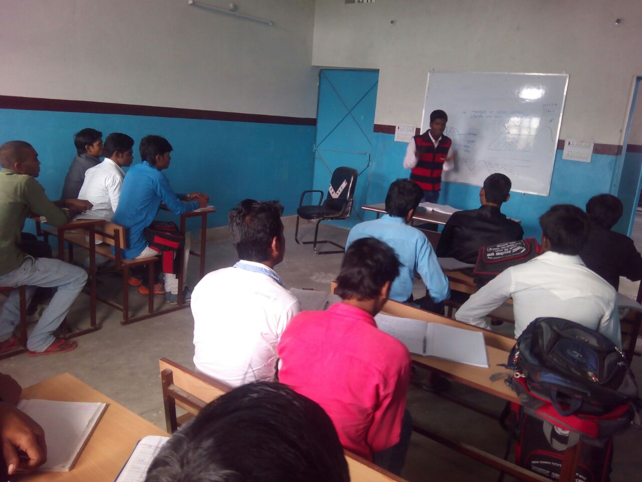 Instructor teaching at whiteboard